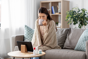 Image showing sick woman having video call on tablet pc at home