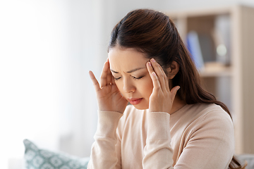 Image showing sick asian woman having headache at home