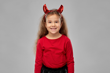 Image showing girl in halloween costume and devil's horns