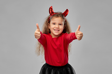 Image showing girl in black dress and devil's horns on halloween