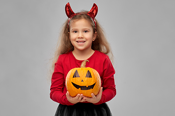 Image showing girl in halloween costume with jack-o-lantern