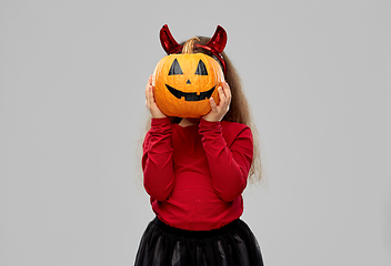 Image showing girl in halloween costume with jack-o-lantern