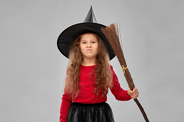 Image showing girl in black witch hat with broom on halloween