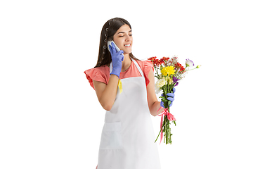 Image showing Young woman, florist with bouquet isolated on white studio background