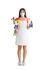 Image showing Young woman, florist with bouquet isolated on white studio background