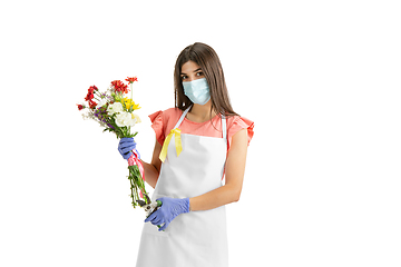 Image showing Young woman, florist with bouquet isolated on white studio background