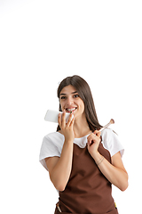 Image showing Young woman, visagiste with cosmetics isolated on white studio background