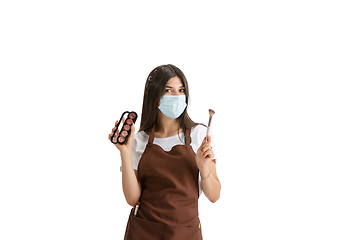 Image showing Young woman, visagiste with cosmetics isolated on white studio background