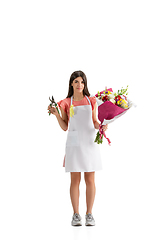 Image showing Young woman, florist with bouquet isolated on white studio background