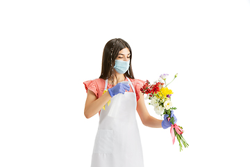 Image showing Young woman, florist with bouquet isolated on white studio background