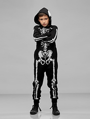 Image showing boy in black halloween costume with skeleton bones