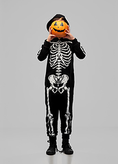 Image showing boy in halloween costume with jack-o-lantern