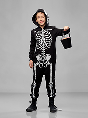 Image showing boy with candies trick-or-treating on halloween