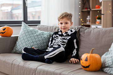 Image showing happy boy in halloween costume of skeleton at home