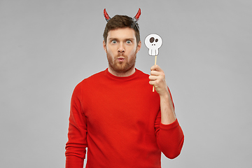 Image showing man in halloween costume of devil over grey