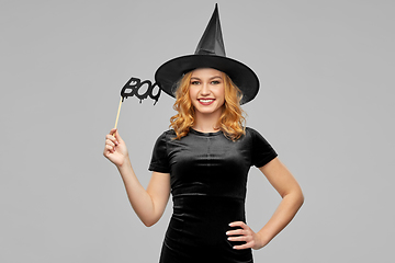 Image showing woman in halloween costume of witch with accessory