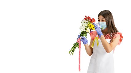 Image showing Young woman, florist with bouquet isolated on white studio background