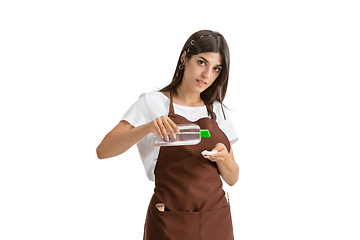 Image showing Young woman, visagiste with cosmetics isolated on white studio background