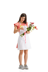 Image showing Young woman, florist with bouquet isolated on white studio background