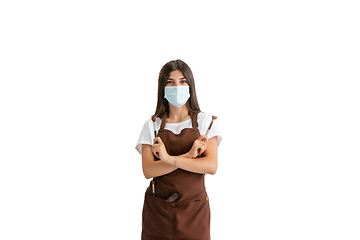 Image showing Young woman, visagiste with cosmetics isolated on white studio background