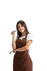 Image showing Young woman, visagiste with cosmetics isolated on white studio background