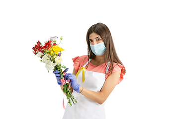 Image showing Young woman, florist with bouquet isolated on white studio background