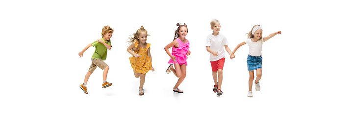 Image showing Happy little caucasian kids jumping and running isolated on white background