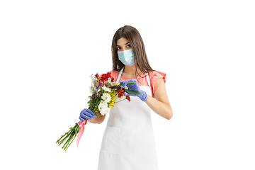 Image showing Young woman, florist with bouquet isolated on white studio background