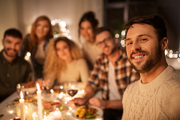 Image showing friends taking selfie at christmas dinner party