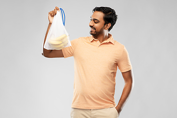 Image showing happy man holding reusable string bag with bananas