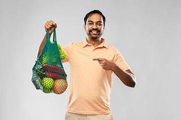 Image showing happy indian man with food in reusable net tote