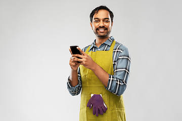 Image showing indian male gardener or farmer with smartphone