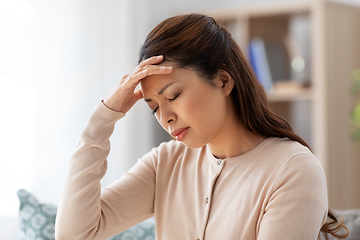 Image showing sick asian woman having headache at home