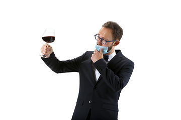 Image showing Portrait of male sommelier in suit isolated over white background