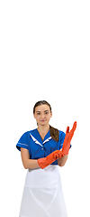 Image showing Portrait of female made, cleaning worker in white and blue uniform isolated over white background