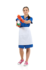 Image showing Portrait of female made, cleaning worker in white and blue uniform isolated over white background