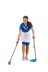 Image showing Portrait of female made, cleaning worker in white and blue uniform isolated over white background