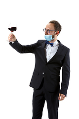 Image showing Portrait of male sommelier in suit isolated over white background