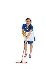 Image showing Portrait of female made, cleaning worker in white and blue uniform isolated over white background