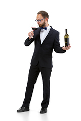 Image showing Portrait of male sommelier in suit isolated over white background