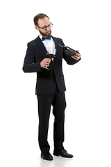 Image showing Portrait of male sommelier in suit isolated over white background