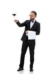 Image showing Portrait of male sommelier in suit isolated over white background