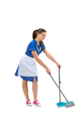 Image showing Portrait of female made, cleaning worker in white and blue uniform isolated over white background