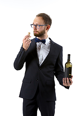 Image showing Portrait of male sommelier in suit isolated over white background