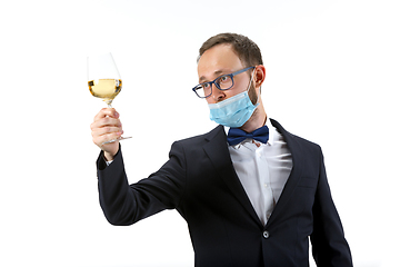 Image showing Portrait of male sommelier in suit isolated over white background