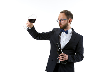 Image showing Portrait of male sommelier in suit isolated over white background