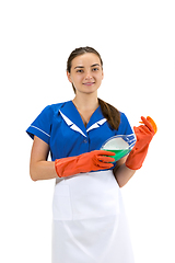 Image showing Portrait of female made, cleaning worker in white and blue uniform isolated over white background