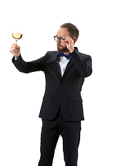 Image showing Portrait of male sommelier in suit isolated over white background