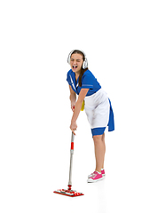 Image showing Portrait of female made, cleaning worker in white and blue uniform isolated over white background