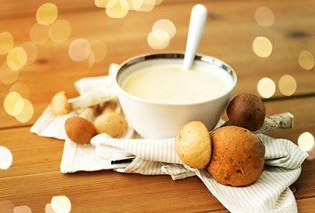 Image showing mushroom cream soup in bowl on cutting board